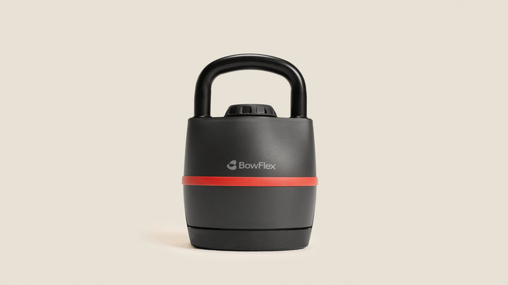 Front view of the BowFlex SelectTech 840 Kettlebell against a tan background.