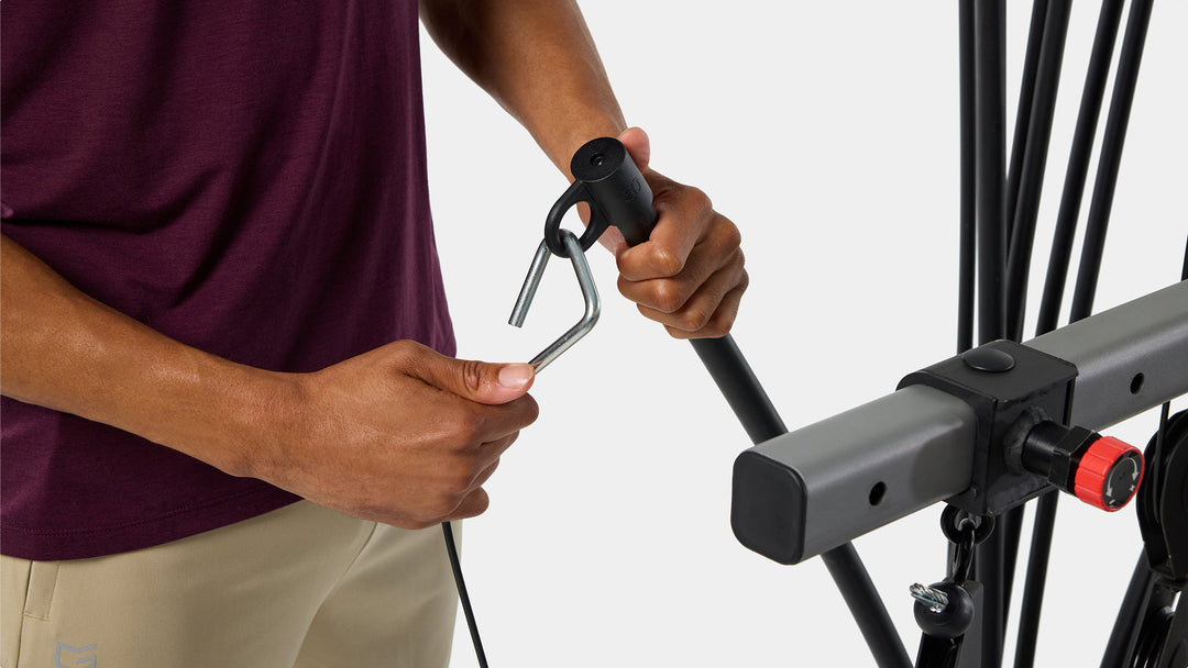 Hands adjusting the Power Rod® resistance weight on the BowFlex Xtreme 2 SE Home Gym.