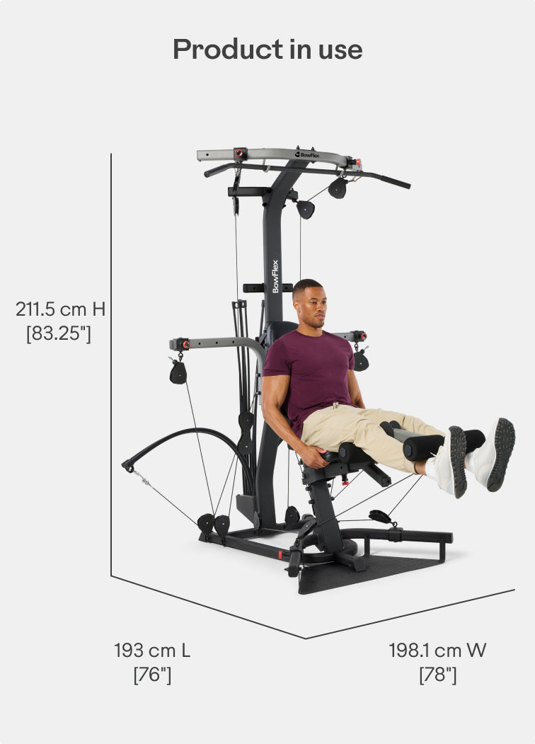 Angled view of the BowFlex Xtreme 2 SE Home Gym in use with dimension labels on a white background.