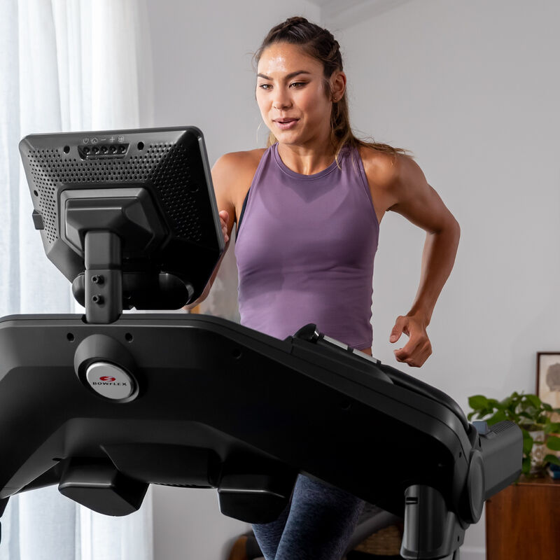 A woman running on a Treadmill 25. - mobile expanded view