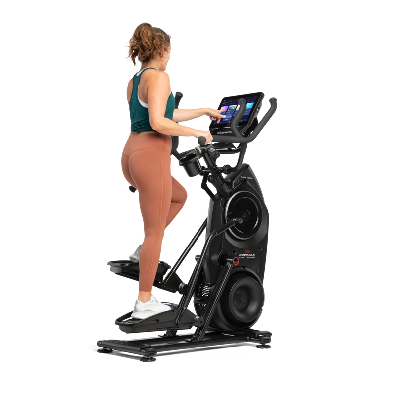 A woman exercising on a Bowflex Max Trainer 40. - mobile expanded view