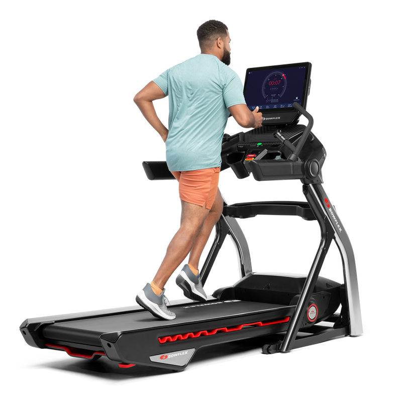 Man using the touchscreen on the Treadmill 56  - expanded view
