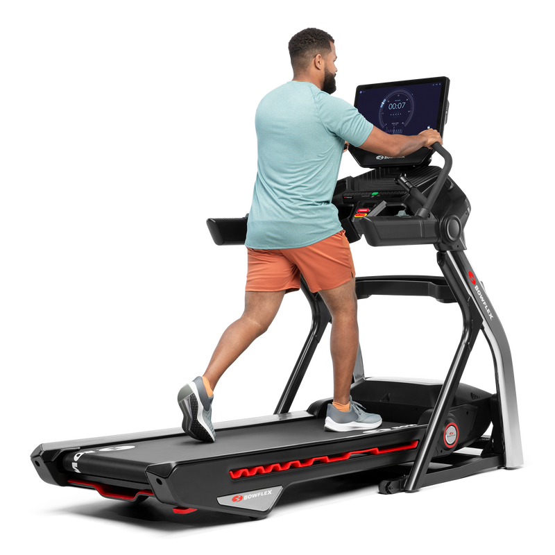 Man using the extended handlebars on the Treadmill 56  - expanded view