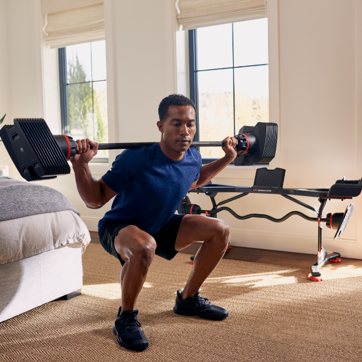 man lifting weights