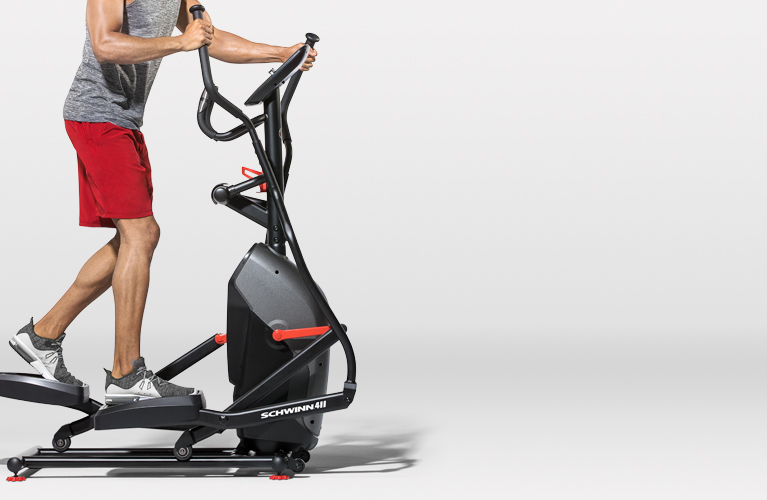 Man working out on a Schwinn elliptical